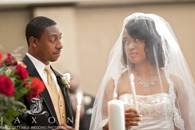 Couple lights the unity candle | Eagles Landing Country Club Wedding