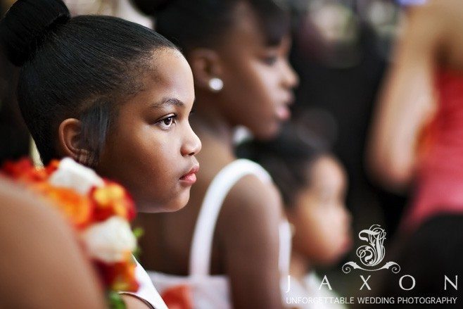 Flower girl look on at the proceedings Eagles Landing Country Club Wedding