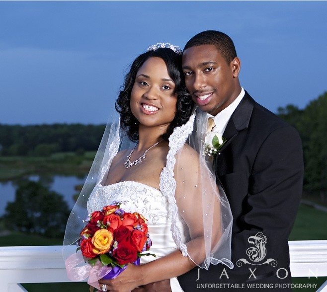 Portrait of the couple on the back deck at Eagle's Landing Country Club