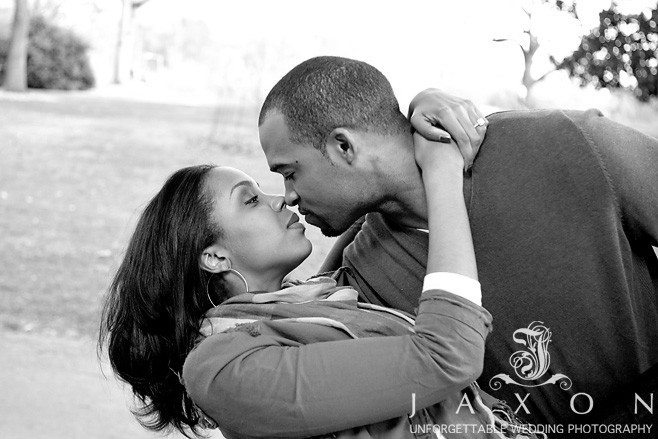 black and white image the couple enjoys a tender embrace on the grounds of Piedmont Park