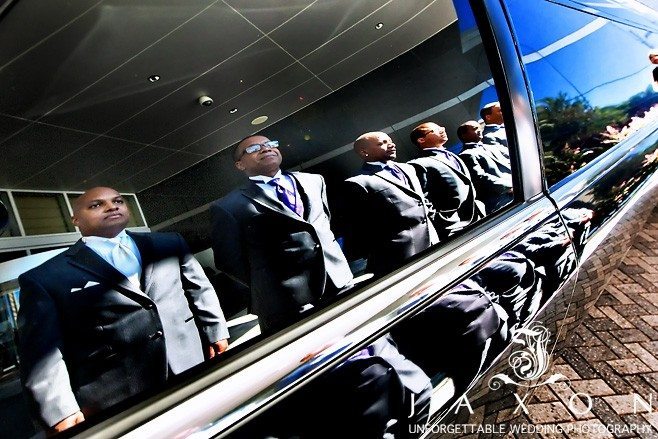 reflection of groom and his party images on the window of the highly polished limo |Atlanta Gardens Wedding