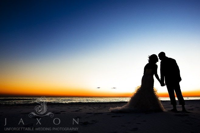 Twilight photograph of the bride and groom on the beach | Majestic elegance wedding Punta Cana