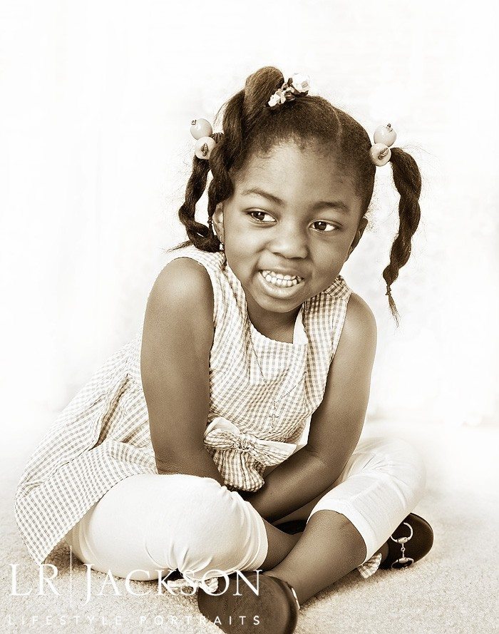 Sepia portrait of little girl smiling