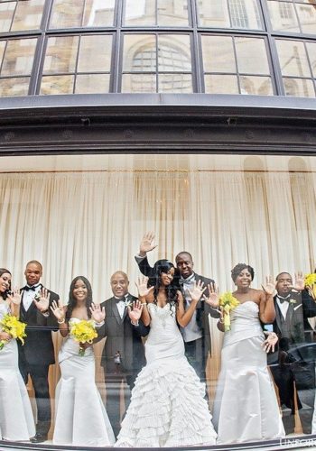 Wedding party strike a pose in the window at 200 Peachtree in downtown Atlanta