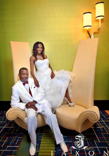 Bride and groom on fancy chair at Marriott Gateway Atlanta wedding