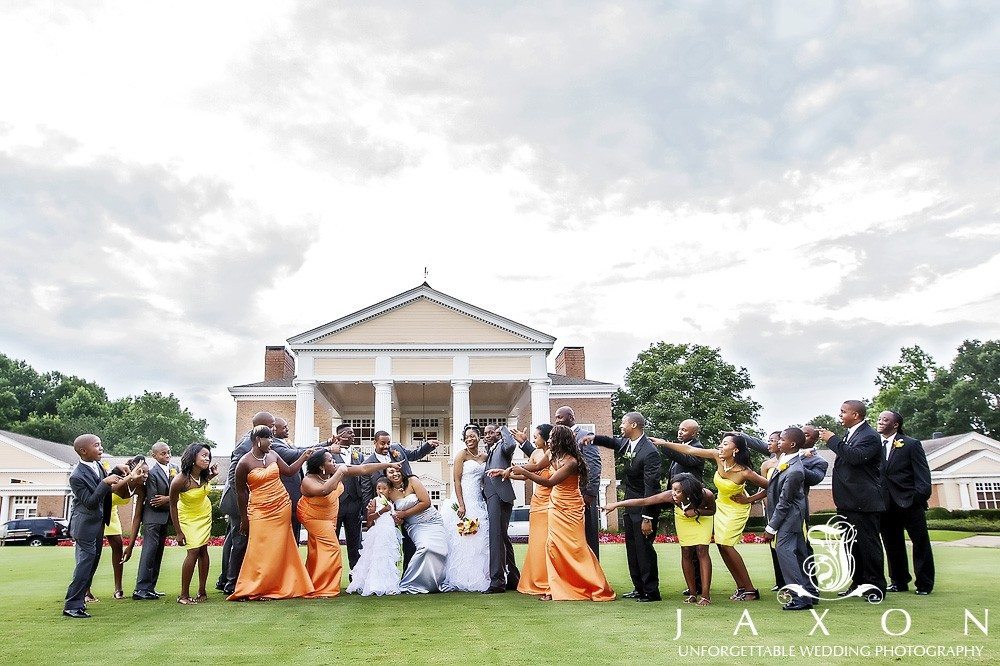 Wedding party of 26 on the lawn in front of the club house | Eagle's Landing Country Club Wedding