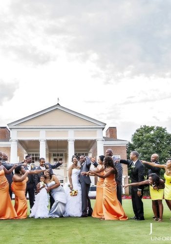 Wedding party on the lawn infront of the Eagles Landing Club House