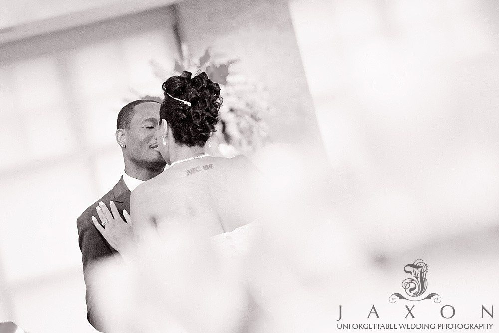 in this black and white image the couple enjoys their first dance | Eagle's Landing Country Club Wedding