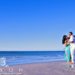 Couple dances on the beach in Destin FL during their engagement session