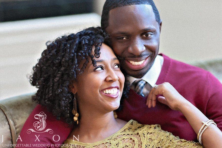 couple shares a laugh during their Georgian Terrace Hotel engagement session