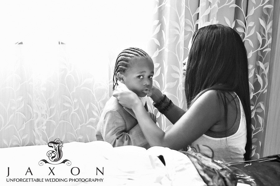 Ring bearer getting dressed at the Sheraton in Brooklyn, NY |The Riviera Wedding Brooklyn, NY