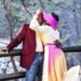 Stealing a kiss at the covered bridge during engagement session