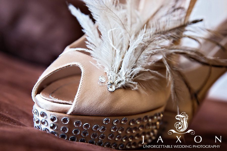 The beautiful bridal shoes with rhinestones on the platform and the peep toe area adorned with feathers