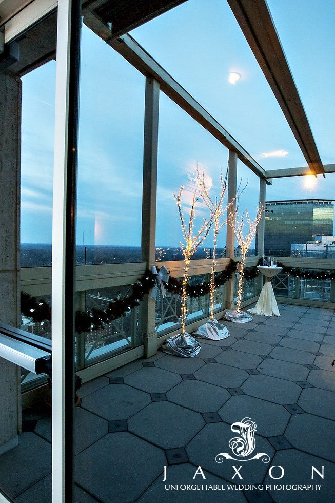 Peachtree Club rooftop ceremony area reflected in the glass doorway