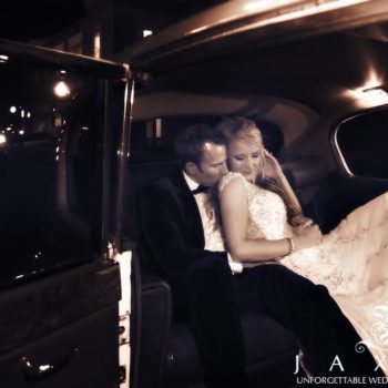 Couple in the backseat of a vintage Rolls at the end off the night | Peachtree Club Rooftop Wedding