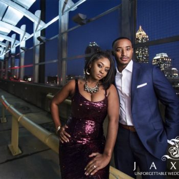 Beautifully dressed young couple he is in a blue suite and she is wearing a metallic spaghetti strap plum dress, adding some sophistication on 17th St Bridge in Atlantic Station Atlanta