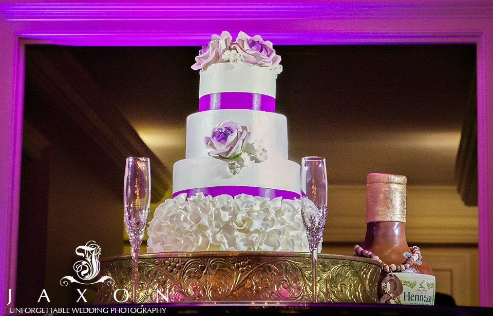 white 4 tiered round wedding cake with ruffled base by Perfect Wedding Cake