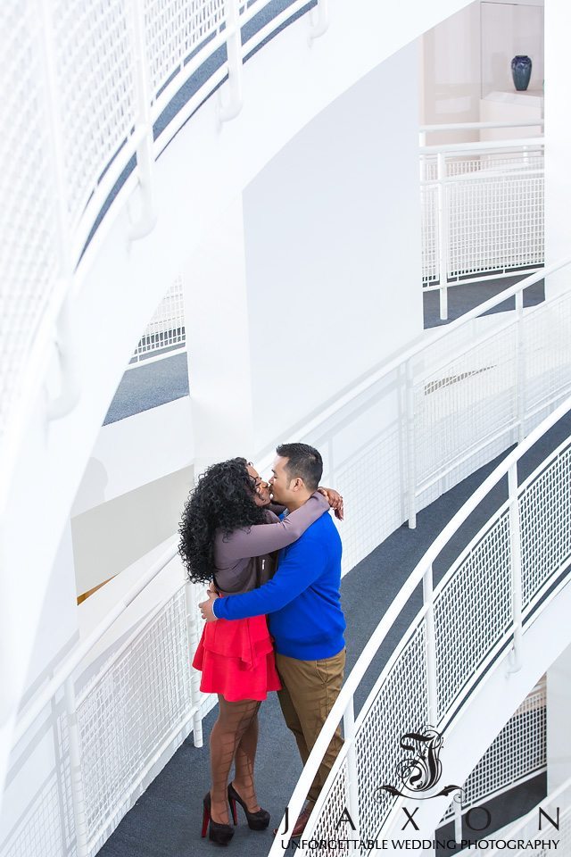 Couple embraces and kissed on the ramp inside the Hight museum of Art in Atlanta