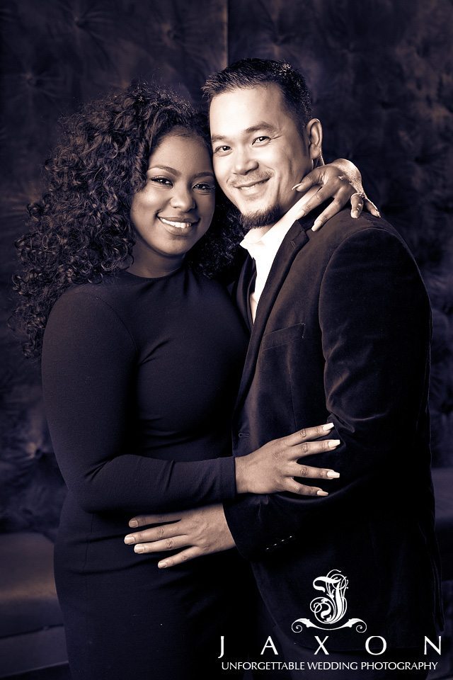 Sepia toned portrait of dressed up smiling couple during their engagement photography session