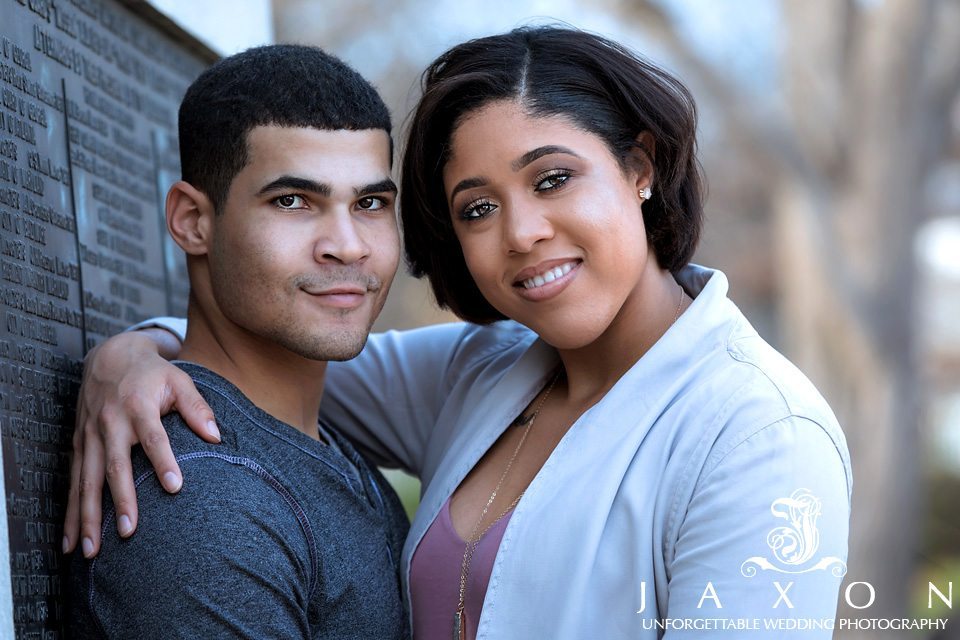 Couple embracing and looking at camera