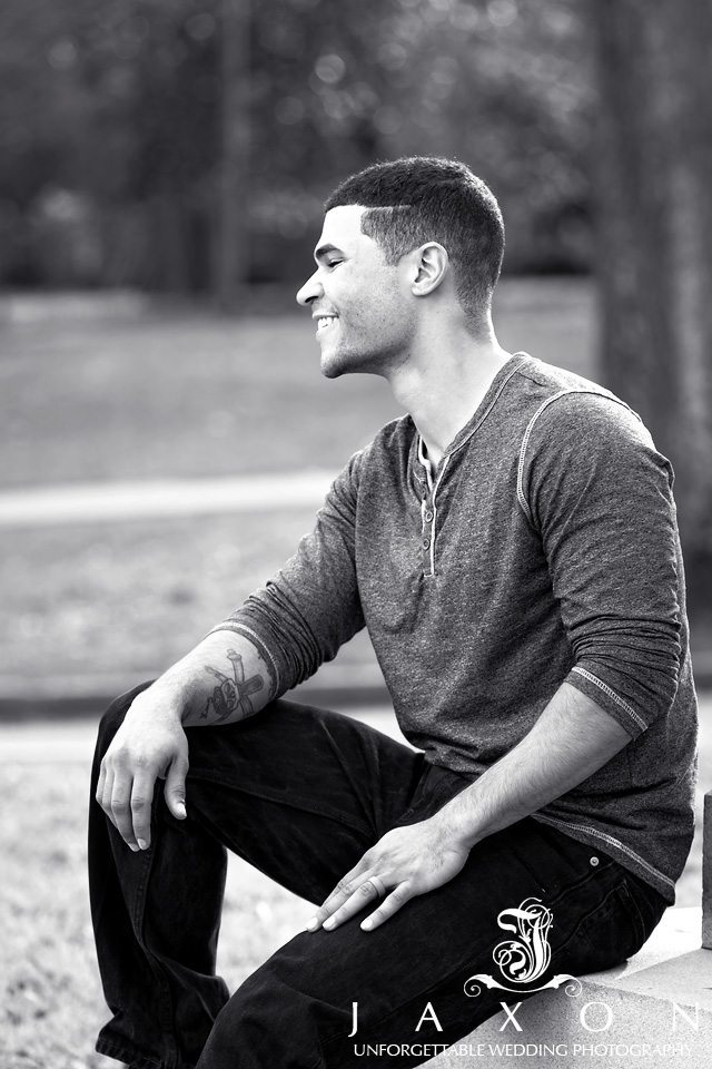 Male sitting on base of Monument at Piedmont Park