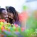 Couple sharing a laugh amongst the colorful flowers at Woodruff Park in downtown Atlanta