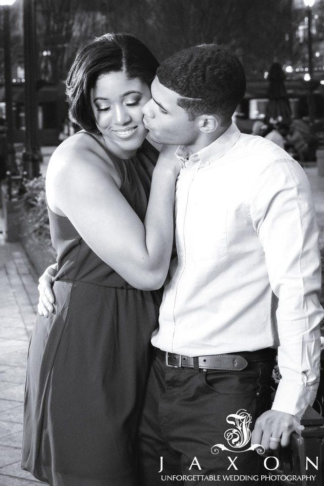 B&W portrait of couple embracing at Woodruff Park Atlanta at night 