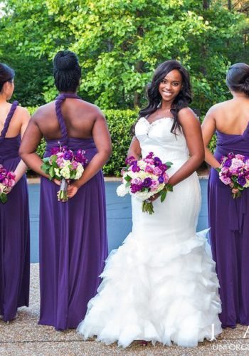 Bridesmaids in plum-colored convertible dresses at Doubletree Hotel Roswell wedding