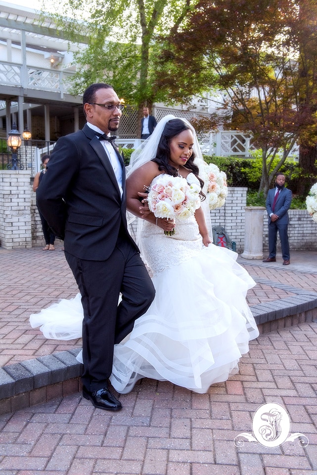 Bride escorted into ceremony