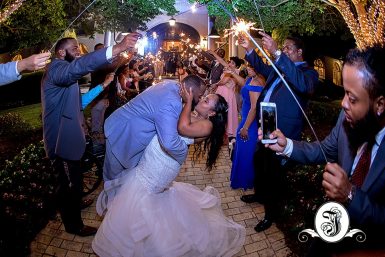 One last kiss as bride and groom exits their Vines Mansion Wedding