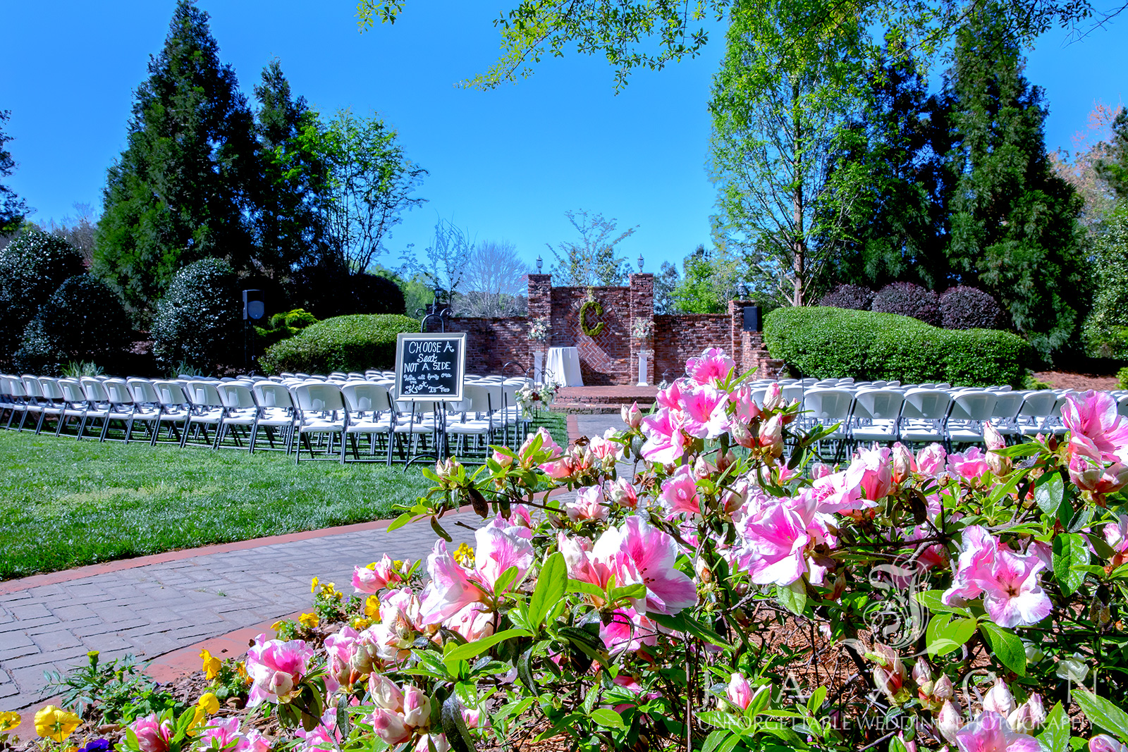 Azalea-ringed gardens decorated for a wedding ceremony at Carl House, showcasing options for both outdoor and indoor weddings with beautiful decoration ideas.