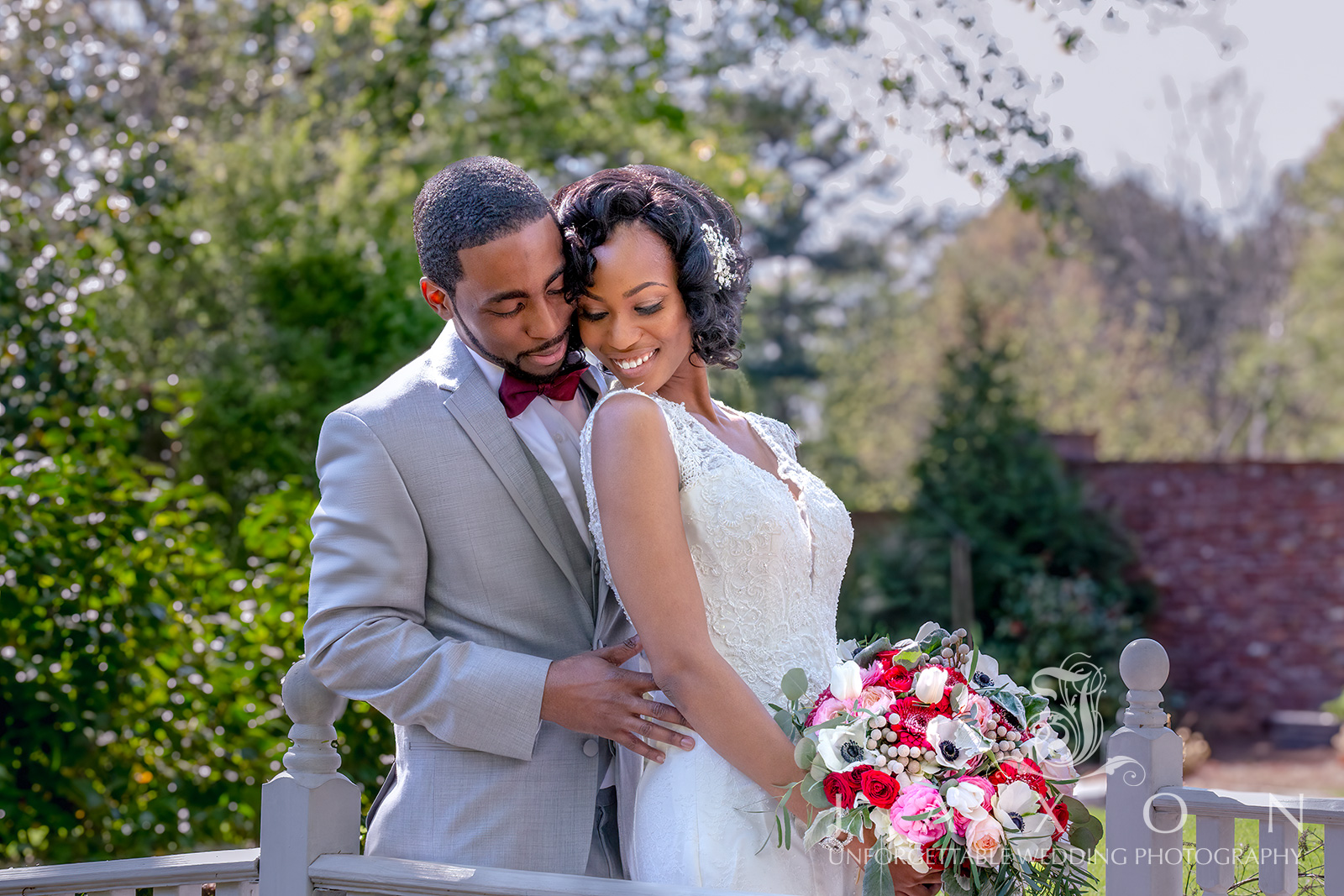 Couple shares a tender moment on the bridge at Carl House